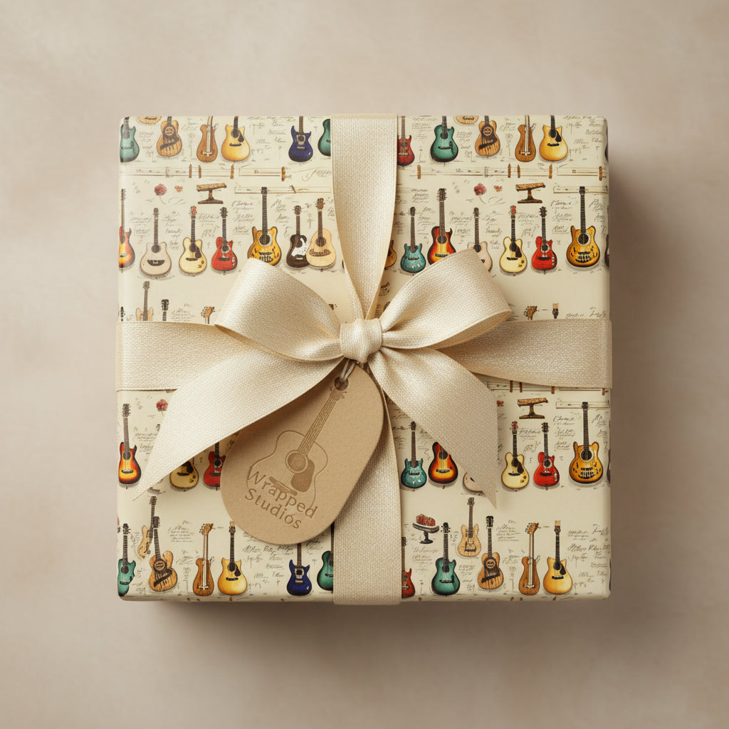 Gift wrapped in guitar-themed wrapping paper with a cream satin ribbon and tag; perfect for musicians' birthday gifts.
