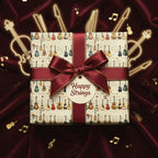 Guitar-themed gift wrap with burgundy ribbon and "Happy Strings" tag, perfect for musicians.