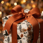 Vintage ghost Halloween wrapping paper with a burnt orange ribbon. Spooky gift wrap by Wrapped Studios.