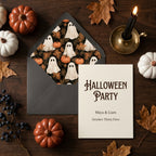 Vintage ghost envelope liner and Halloween party invitation on a rustic wood table by Wrapped Studios.