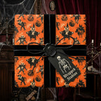 Spooky vintage Halloween wrapping paper in orange and black with skeleton gift tag by Wrapped Studios.