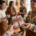 Exchanging a gift wrapped in vintage floral wrapping paper with a pink velvet bow by Wrapped Studios.