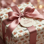 Vintage floral birthday wrapping paper with pink roses and satin ribbon by Wrapped Studios.