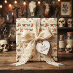 Vintage floral wrapping paper with roses and butterflies, tied with a lace ribbon by Wrapped Studios.