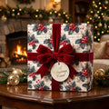 Vintage holly Christmas wrapping paper with a red velvet bow by Wrapped Studios.
