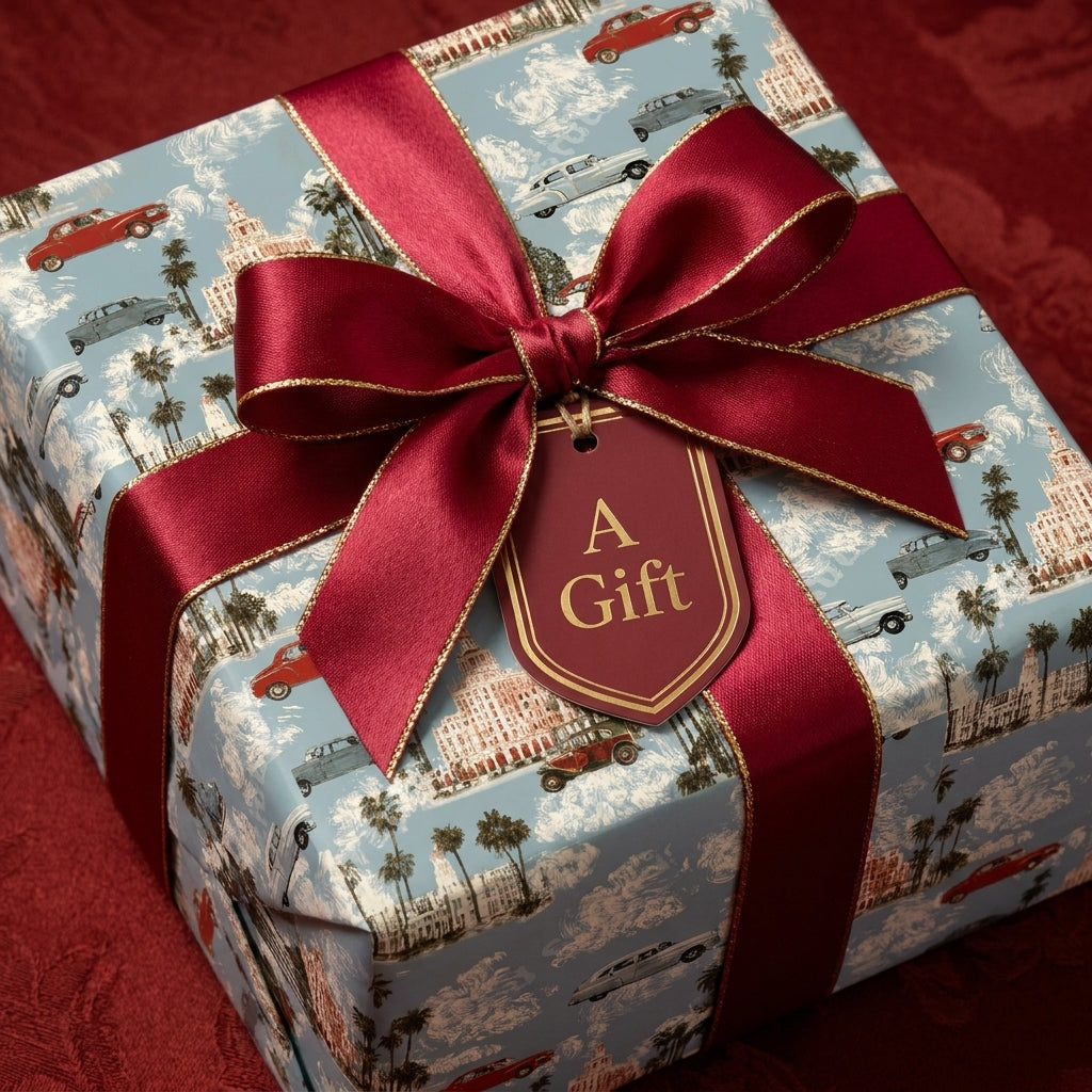 Vintage travel wrapping paper with classic cars, featuring a luxury red ribbon and gift tag by Wrapped Studios.
