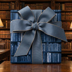 Vintage book themed wrapping paper with a large blue ribbon bow by Wrapped Studios.
