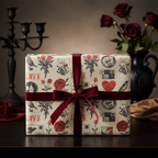 Vintage romantic gift wrap with red roses, birds, and "LOVE" text, tied with a luxurious deep red velvet ribbon, perfect for Valentine's Day.