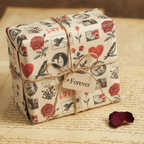 Vintage romantic wrapping paper with red roses, black birds, and hearts, tied with twine and a "Forever" tag, on old love letters.
