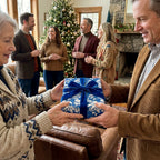 Blue Nativity Christmas gift wrap with a velvet bow by Wrapped Studios, exchanged at a holiday family gathering.