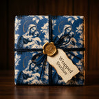 Vintage blue Madonna and Child religious Christmas wrapping paper with gold wax seal by Wrapped Studios.