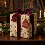 Vintage Christmas wrapping paper with map print and burgundy velvet bow by Wrapped Studios.