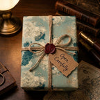 Vintage nautical map wrapping paper by Wrapped Studios, tied with rustic twine on a luxury gift box.