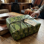 Father's Day wrapping paper with green vintage military soldier print on a gift for Dad by Wrapped Studios.