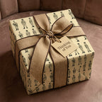 Military soldier wrapping paper with a burlap bow and Thinking of You tag by Wrapped Studios.