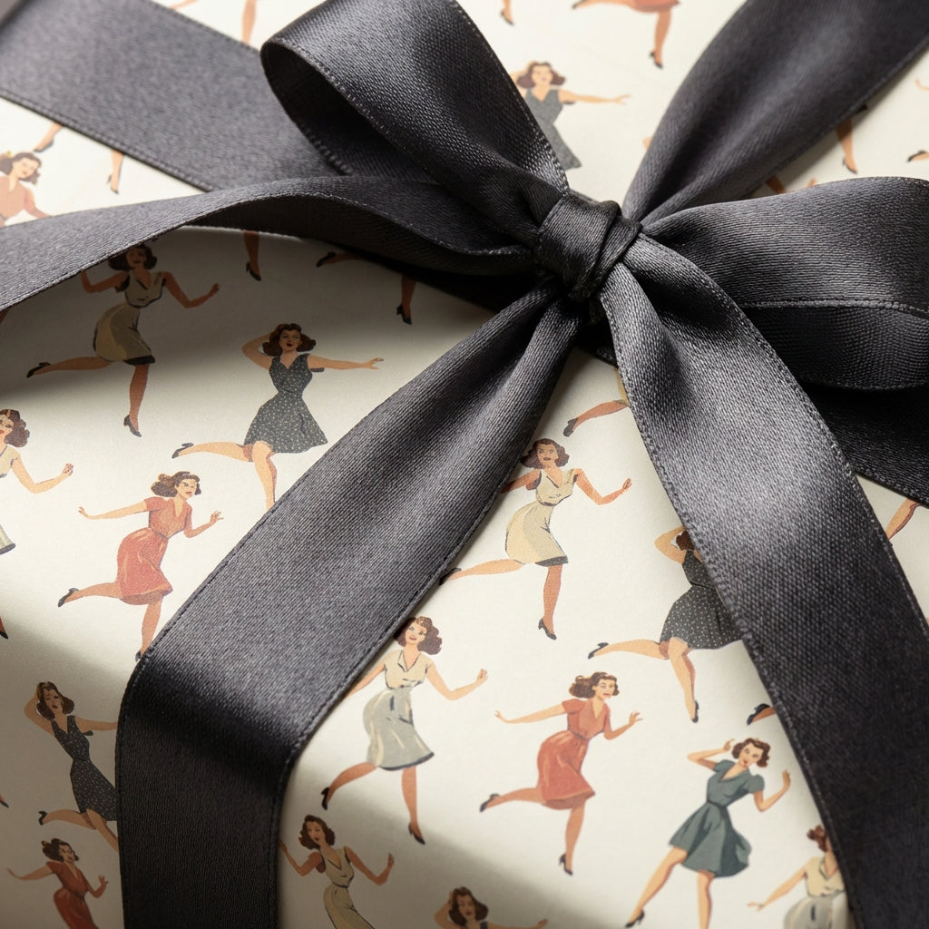 Gift wrapped in retro-style wrapping paper with a gray satin ribbon.