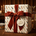 Gift box with vintage-style dancing girl wrapping paper and rusty red velvet ribbon.