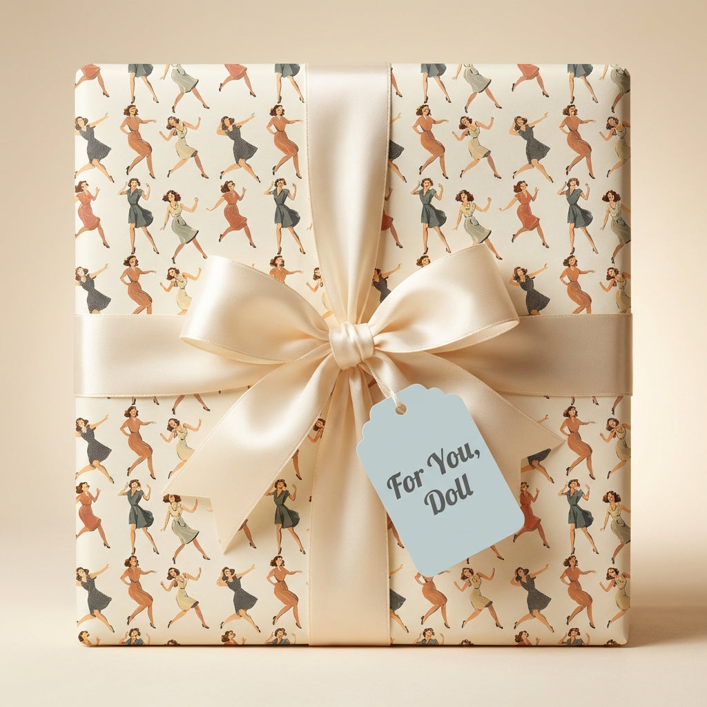 Retro-style gift wrap with dancing women pattern, ivory ribbon, and "For You, Doll" tag.