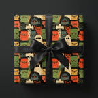 Spooky monster Halloween wrapping paper with a black satin bow by Wrapped Studios.