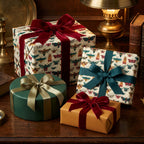 Elegant gift boxes wrapped in moth-patterned paper with velvet ribbons for luxury gift giving.