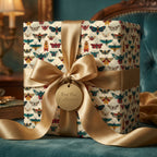 Elegant gift wrapped in insect-themed wrapping paper with gold ribbon and "For the Collector" tag.