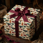 Elegant gift box wrapped in vintage-style butterfly wrapping paper with a burgundy ribbon.