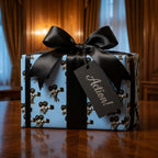 Blue vintage film camera wrapping paper with a luxury black bow by Wrapped Studios.