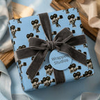 Vintage movie camera wrapping paper in light blue with a grey velvet ribbon by Wrapped Studios.