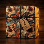 Retro movie star gift wrap on a square present tied with black string and a "Cheers" tag.