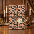 Retro movie wrapping paper in pink with vintage film reels and star birthday tag by Wrapped Studios.
