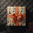 Unique guitar-themed gift wrap with orange ribbon, perfect for the music lover's birthday.