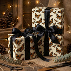 Elegant butterfly wrapping paper on gifts tied with black satin ribbon, rustic wood background.
