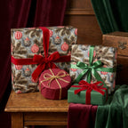 Luxury vintage Christmas wrapping paper with pine and ornament pattern on gifts by Wrapped Studios.