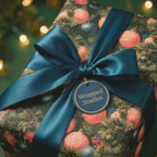 Luxury Christmas wrapping paper with a vintage ornament pattern and teal satin bow by Wrapped Studios.