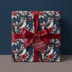 Luxury owl Christmas wrapping paper in navy blue and red, tied with a burgundy bow by Wrapped Studios.