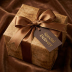 Vintage wrapping paper with luxury brown ribbon and Special Delivery tag by Wrapped Studios.