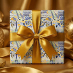Luxury Paris wrapping paper with Eiffel Tower pattern and gold satin bow, by Wrapped Studios.