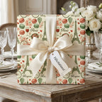 Paris themed luxury wrapping paper with Eiffel Towers, macarons, and cream ribbon by Wrapped Studios.