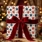 Vintage red and blue star holiday wrapping paper with a luxury red velvet ribbon by Wrapped Studios.