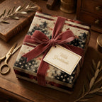 Vintage American flag wrapping paper with a velvet ribbon and gift tag by Wrapped Studios.