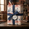 Vintage patriotic wrapping paper with a rustic American flag pattern and blue bow by Wrapped Studios.