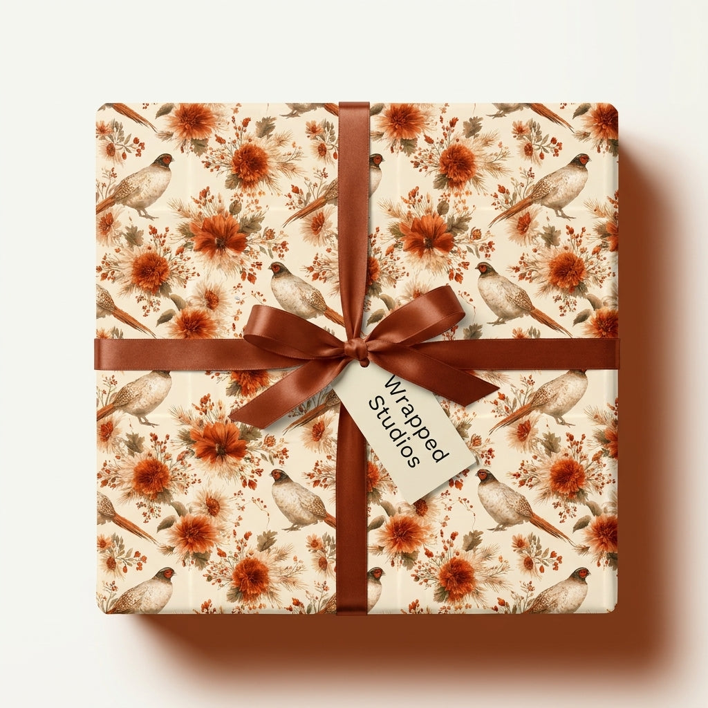Rustic pheasant and floral wrapping paper with brown satin ribbon on a gift box, by Wrapped Studios.