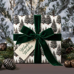 Elegant pine tree Christmas wrapping paper with a green velvet bow by Wrapped Studios.