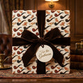 Vintage pipe wrapping paper with a brown velvet ribbon and gentleman gift tag by Wrapped Studios.