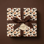 Masculine vintage tobacco pipe wrapping paper with a brown ribbon bow, by Wrapped Studios.