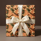 Vintage masculine wrapping paper with tobacco pipe print and ivory satin bow by Wrapped Studios.