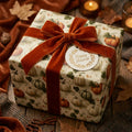 Autumn pumpkin wrapping paper with rust velvet ribbon and Happy Harvest tag by Wrapped Studios.