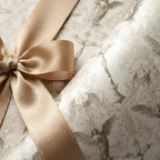 Vintage angel religious wrapping paper with champagne gold satin bow by Wrapped Studios.