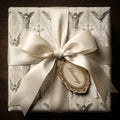 Religious angel wrapping paper for baptism with cream satin bow and Blessings tag by Wrapped Studios.
