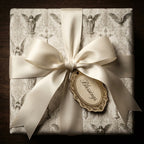 Religious angel wrapping paper for baptism with cream satin bow and Blessings tag by Wrapped Studios.